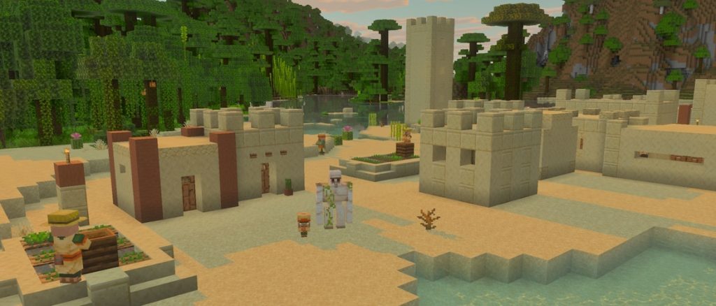 Minecraft Bedrock 26.60 official artwork: a desert village with a jungle in the background